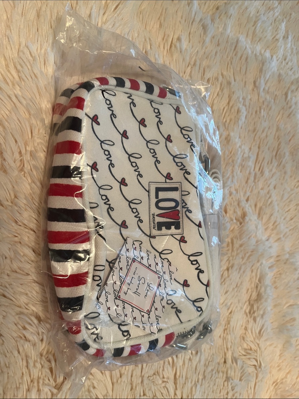 Brighton White Crossbody Bag with Red and Black Stripe Trim and Love Script
